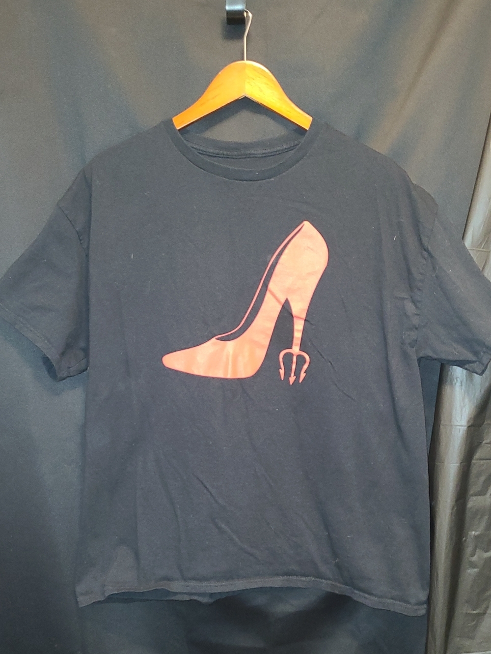 Devil Wears P**da" inspired design of a red stiletto heel shaped like a trident.